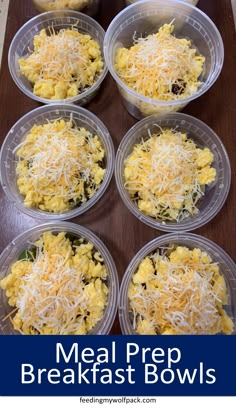 six plastic containers filled with breakfast bowls on top of a wooden table, text reads meal prep breakfast bowls