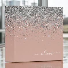 a pink box with silver glitter on it