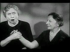 two women are making faces while one holds her hands together