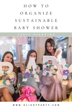 three women holding up letters that spell out the word, how to organize sustenable baby shower