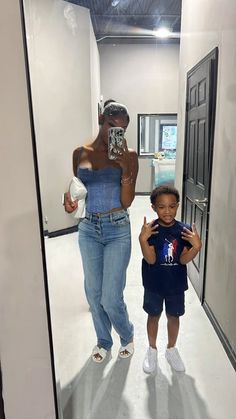 a woman taking a selfie with a child