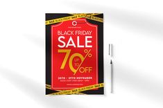 a black friday sale sign on a white background with a pen next to it that says, black friday sale up to 70 % off