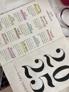 a handwritten calendar with numbers and symbols on it