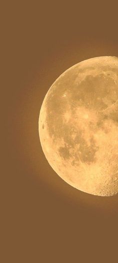 an airplane flying in front of the moon