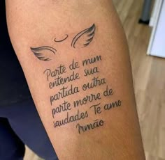 a person with a tattoo on their arm that has words written in spanish and english