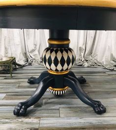 a black and white checkered table with gold accents