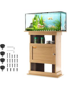 a fish tank is on top of a stand with other items in front of it