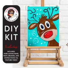 an easel with a painting of a reindeer on it