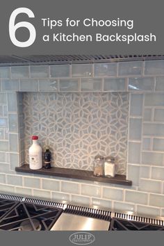 a stove top oven sitting inside of a kitchen next to a counter with a bottle on it