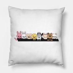 a group of animals sitting on top of a white pillow