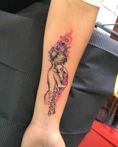 a woman's arm with a tattoo on it