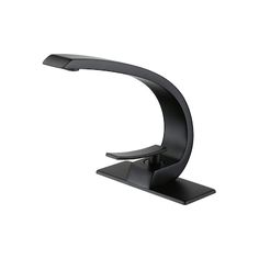 a black desk lamp on a white background