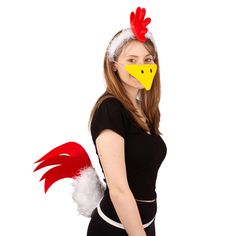 a woman wearing a chicken mask and black dress