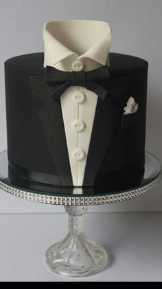 a black and white cake with a tuxedo on top