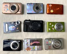 there are many different types of cameras on the table together, including one for kids and one for adults