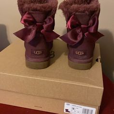 Uggs Burgundy/Maroon Color Slight Glitter Sheen Bows On The Back Excellent Condition Comes With Original Box Size 6 Elliana Aesthetic, Mcbling Clothing, Trendy Winter Shoes, Fur Uggs, Red Uggs, Space Shoes, Ugg Boots With Bows, Cute Uggs, Uggs With Bows