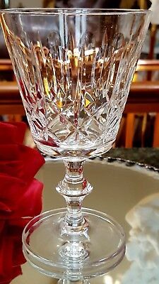 an empty wine glass sitting on top of a table