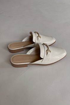 The Reese Slide Mules features a golden metallic buckle, ivory faux leather, and a slide-on style. We recommend sizing up half a size in this style. Order Now, Slides, Faux Leather, Take That, Buckle, Boutique, Leather, Gifts