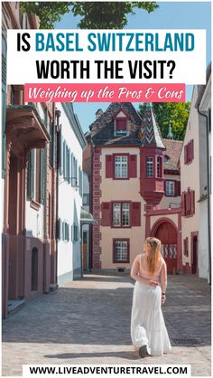 a woman standing in front of a building with the words is base switzerland worth the visit?