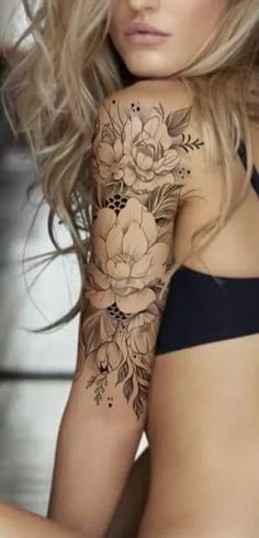 a beautiful woman with flowers on her arm