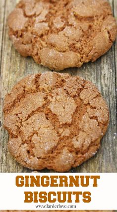 two gingernut cookies sitting on top of a wooden table