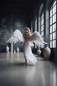 an angel with white wings is standing in a room