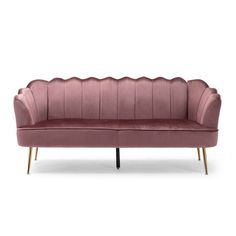 a pink velvet sofa with gold legs and scalloped backrests on an isolated white background