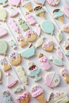 an assortment of decorated cookies on a table