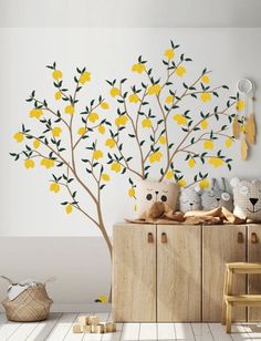 a wall with lemon tree decals on it in a child's playroom