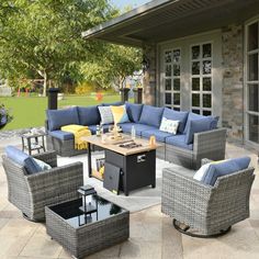 an outdoor living room with blue and gray furniture