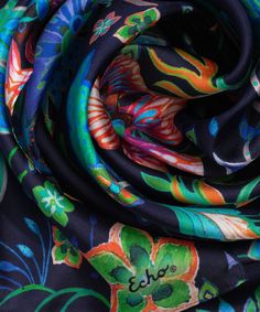 This versatile, 100% silk scarf adds a colorful floral pop to a spring or summer ensemble. Wear it as a flowing head wrap, tie it around the neck or even wear it as an eye-catching belt. Dimensions: 13 in. x 72 in.Materials: 100% Silk Silk Scarves With Floral Print For Spring, Silk Floral Print Scarves For Summer, Multicolor Floral Print Scarf For Beach, Multicolor Floral Print Beach Scarf, Multicolor Silk Scarf For Spring Beach, Multicolor Floral Print Headscarf For Spring, Multicolor Silk Headscarf For Spring, Black Silk Scarf With Floral Print, Black Silk Scarves With Floral Print