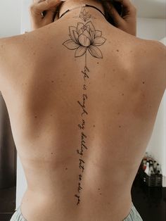 a woman with a tattoo on her back