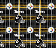 the nfl team is depicted on this black and yellow plaid fabric with football helmets in it