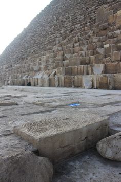 a stone bench sitting in front of the great pyramid