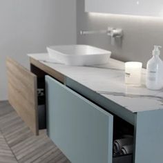 a bathroom counter with two sinks and soap dispensers on it's sides