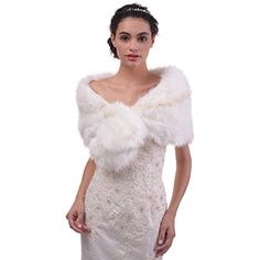 a woman in a white dress and fur stole