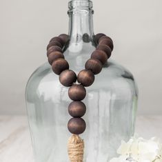 a glass bottle with some beads on it