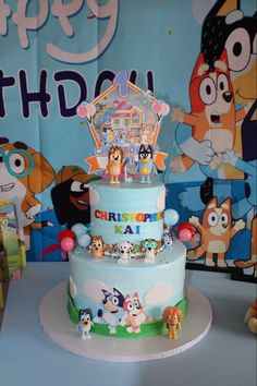 a birthday cake with cartoon characters on it