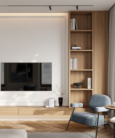 an empty living room with a large tv on the wall and bookshelves in front of it