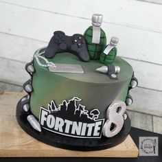 a cake that is decorated to look like a video game controller and some other items