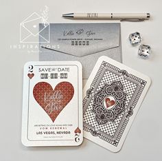 two playing cards, one with a heart and the other with a diamond