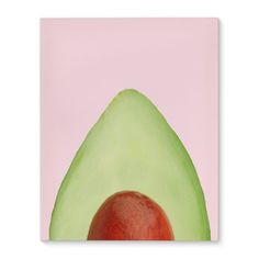 an avocado cut in half on a pink background