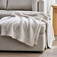 a couch with a blanket on top of it