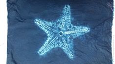 a blue towel with a starfish drawn on it