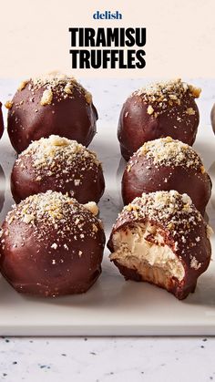 chocolate covered truffles on a white plate