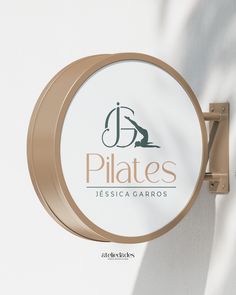 there is a sign for pilates on the wall