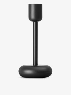 a black candle holder on a white background