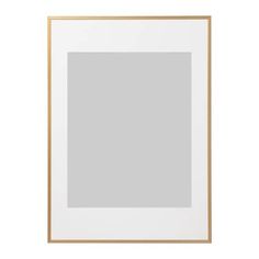 an empty white and gold frame with a light gray wall in the background, on a white