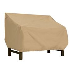 an outdoor bench covered in a tan cover