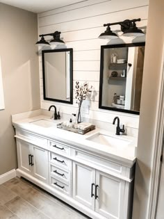 a bathroom with double sinks and two mirrors on the wall above them is featured in an instagram